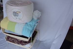 lot 192 image: Assorted quilting & blankets with container