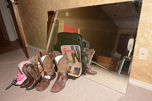 lot 87 image: Western wear including cowboy boots, leg protectors, kid cowboy boots, coonskin caps, & toy guns
