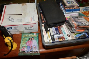 lot 456 image: Movies, CDs, and a box full of metal gift card holder.