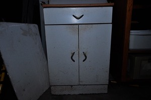lot 285 image: White metal storage cabinet with tan colored top