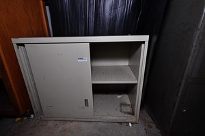 lot 270 image: Metal storage cabinet with sliding door