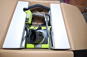 lot 313 image: Ryobi snow blower in original packaging