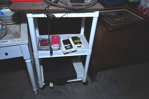 lot 358 image: Plastic portable storage cart with cell phone body covers