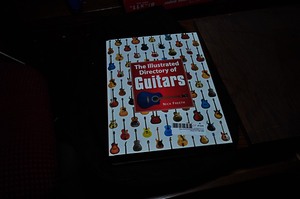 lot 398 image: Guitar Case and The Illustrated Directory of Guitars