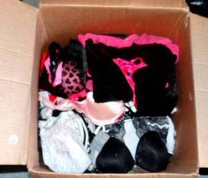 lot 68 image: LARGE BOX FULL OF LINGERIE, SEXY BRAS, AND LEATHER SKIRT