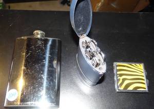 lot 104 image: VANITY COLLECTION - 8 OZ STAINLESS STEEL FLASK, COMPACT WITH MIRROR, AND NAIL CLIPPER SET IN CUSTOM CASE