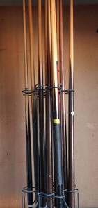 lot 186 image: METAL STAND CONTAINING 11 ASSORTED POOL CUES AND BRIDGES IN EXCELLENT CONDITION