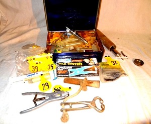 lot 17 image: Cattle tagger & Dewormer kit in Crown Royal tin