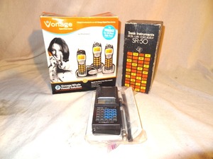 lot 26 image: Misc Electronics lot - vonage phones  realistic handheld scanner  TI SR-50 Calculator