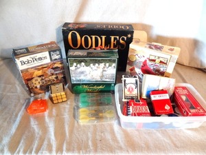 lot 57 image: Game lot - puzzles, cards, poker chips, etc