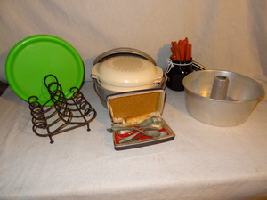 lot 66 image: Kitchen lot - decorative plate holder, bundt pan, pot, forks, spoons, knives, etc
