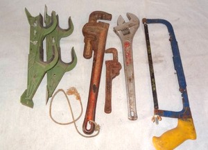 lot 127 image: Tool Lot & Gun rack (Pipe Wrenches, Large Adjustable Wrench, Hacksaw)