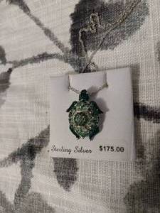 lot 130 image: STERLING SILVER NECKLACE 18 WITH GREEN TURTLE PENDANT WITH STONES. TAG STILL ATTACHED