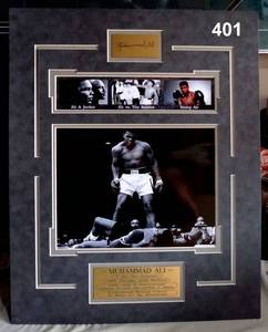 lot 401 image: CUSTOM MATTED MUHAMMAD ALI DISPLAY WITH BRASS ENGRAVED PLATES READY TO FRAME - $99.00 VALUE