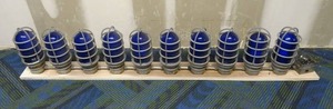 lot 4 image: Set of 10 Blue Glass Lights w Explosion Proof Cages
