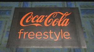 lot 37 image: Authentic Coca-Cola Freestyle Rubber Floor Mat, 3 x 5