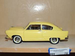 lot 79 image: Yellow 1951 Kaiser Henry J 118 scale model car platinum collection