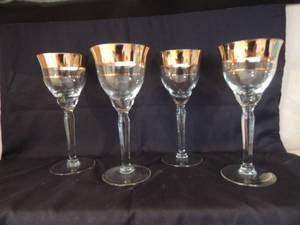 lot 102 image: 4 long stem gold rim wine glasses