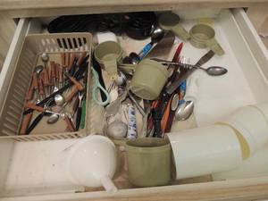 lot 131 image: Various measuring spoons, cups, lobsters forks, spoons, cake knife, baby spoon and more