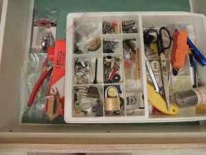 lot 128 image: Plastic container of nuts and bolts screws scissors flashlights and more