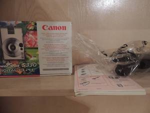 lot 140 image: Canon 35-105mm stylish ultra compact digital camera 2.0 mega pixels power shot S330 tripod