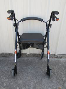 lot 186 image: Black Nova rolling walker with padded seat and storage