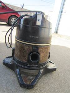 lot 296 image: Rainbow vacuum on wheels has floor attachments and extended handle