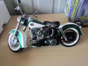 lot 301 image: 1958 Harley Davidson Duo glide Franklin mint has original helmet paperwork and tools