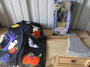lot 302 image: Halloween lot- 2  Vitoria Jones medium knitted sweaters, mideavil wooden ax and dancing monster that plays monster mash