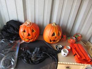 lot 322 image: Halloween witch costume with hat, cape, and wigs, electric jack o lantern, Hallmark tea light holders, ceramic pumpkin tea light holders and pumpkin leaf bags