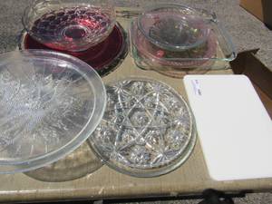 lot 416 image: Christmas tree platter, 10 Pyrex pie plate, 2 qt. Pyrex casserole divided green dish,12 pink cake stand, 11 star of David glass platter 11 bubble glass fruit bowl and more
