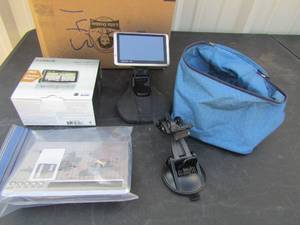 lot 143 image: Garmin Nuvi 1300 LM Map scope for your car comes in box with charger