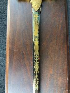 lot 7 image: The Sword of Napoleon recreated in steel and fire gold. On wood with hanger sword 35.5 plaque 40x7 COA