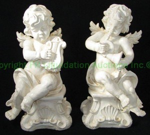 lot 7 image: Plaster cast cherub statues made in Mexico, 19 tall each
