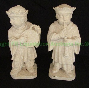 lot 12 image: Stone Renaissance figural musician statues playing a lute and shawm, 21 tall each