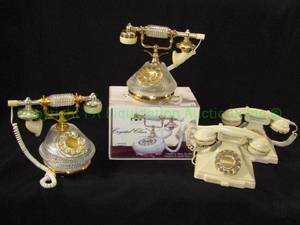 lot 23 image: White marble telephone gold finished accents in box (by Crystalclear.com) and crystal telephones plus