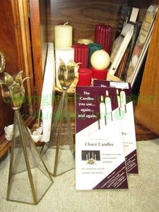lot 31 image: Assorted candles and accessories as shown including dripless taper and pillar candles