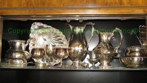 lot 60 image: Assorted silver plate serving ware as shown including repouss pitcher