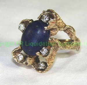 lot 414 image: 14K Gold Blue Stone and Diamond Ring. Abstract Branch Mounting High table Design. Diamonds tested. Blue stone appears to have been cleaned in sonic cleaner and Needs polished. Marked 14K Size 7.5