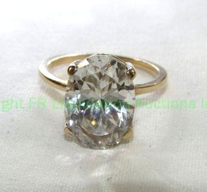 lot 425 image: 10K Gold Ring with Clear Oval Stone (Aquamarine). Marked 10K Size 7 Please preview