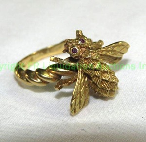 lot 430 image: 18K Gold Ring with Articulated insect topper with sapphire eyes. Marked 18K HR Hallmark within a diamond. Insect moves and can be removed from ring to wear as a pin. Insect has pin back. Two pieces in one Sapphire eyes tested