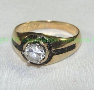 lot 433 image: 14K Gold Ring with white stone. Not diamond. Size 8 Marked 14K Marked WHJ Aug 7 1919 in script