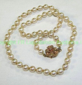 lot 542 image: 14K Gold and pearl 16L necklace with 14K gold and diamond flower clasp. Marked 14K on insert. Pearls individually knotted.