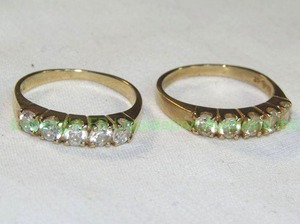lot 440 image: 14K Gold and CZ Rings. Matching pair. Size 7.75 Marked 14K