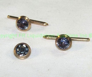 lot 443 image: 14K Gold Vintage Shirt Studs with Purple Sapphire Stones. 2 plus broken top. All marked 14K