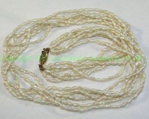 lot 448 image: Freshwater multi strand Rice pearl necklace. 20L No markings 6 strands