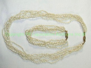 lot 450 image: Freshwater Rice pearl multi strand 18L necklace and bracelet set. No markings.