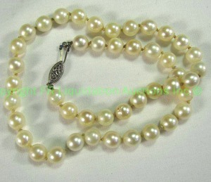lot 541 image: 14K White gold and pearl Necklace 16L Marked 14K on clasp. Pearls individually knotted.