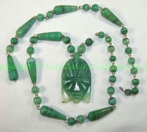 lot 543 image: Vintage green onyx necklace with carved tribal pendant amulet. Needs reconnected. 26L