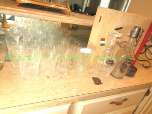 lot 130 image: Assorted crystal tumblers and glassware including a locking sterling silver decanter or liquor bottle cover and more as shown